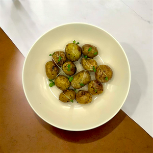 a picture of tender&slice roasted baby potatoes side dish