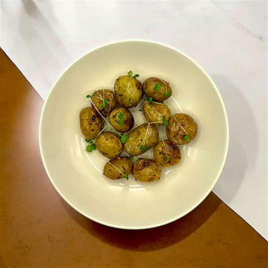 a picture of tender&slice roasted baby potatoes side dish